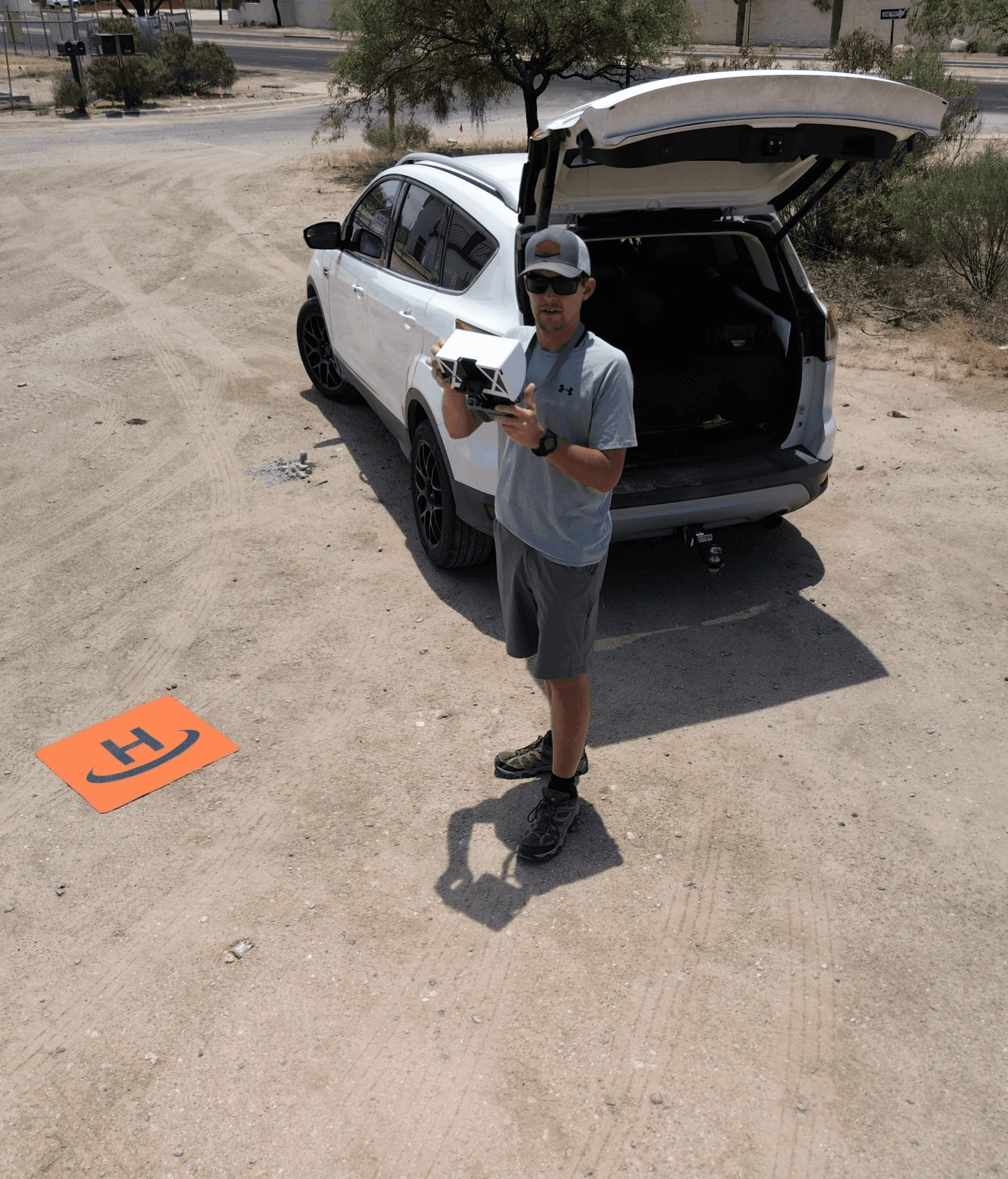 picture of the owner of Southwest Drone Tech flying a drone