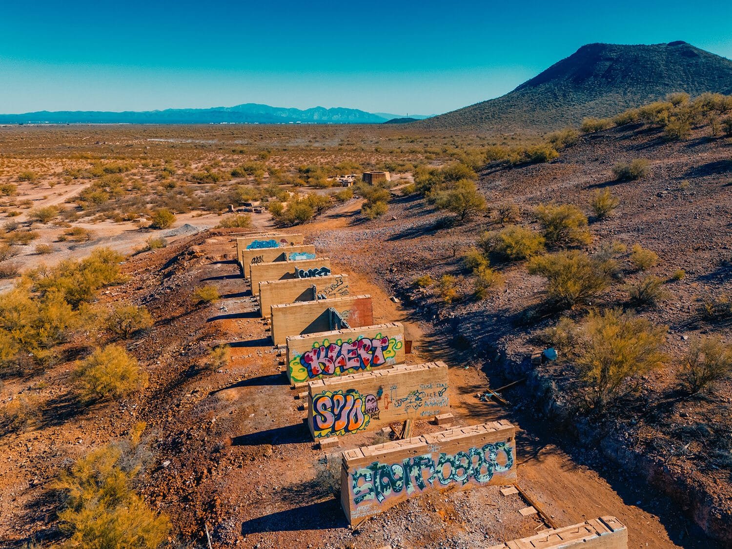 drone photograph of graffiti in the desert.