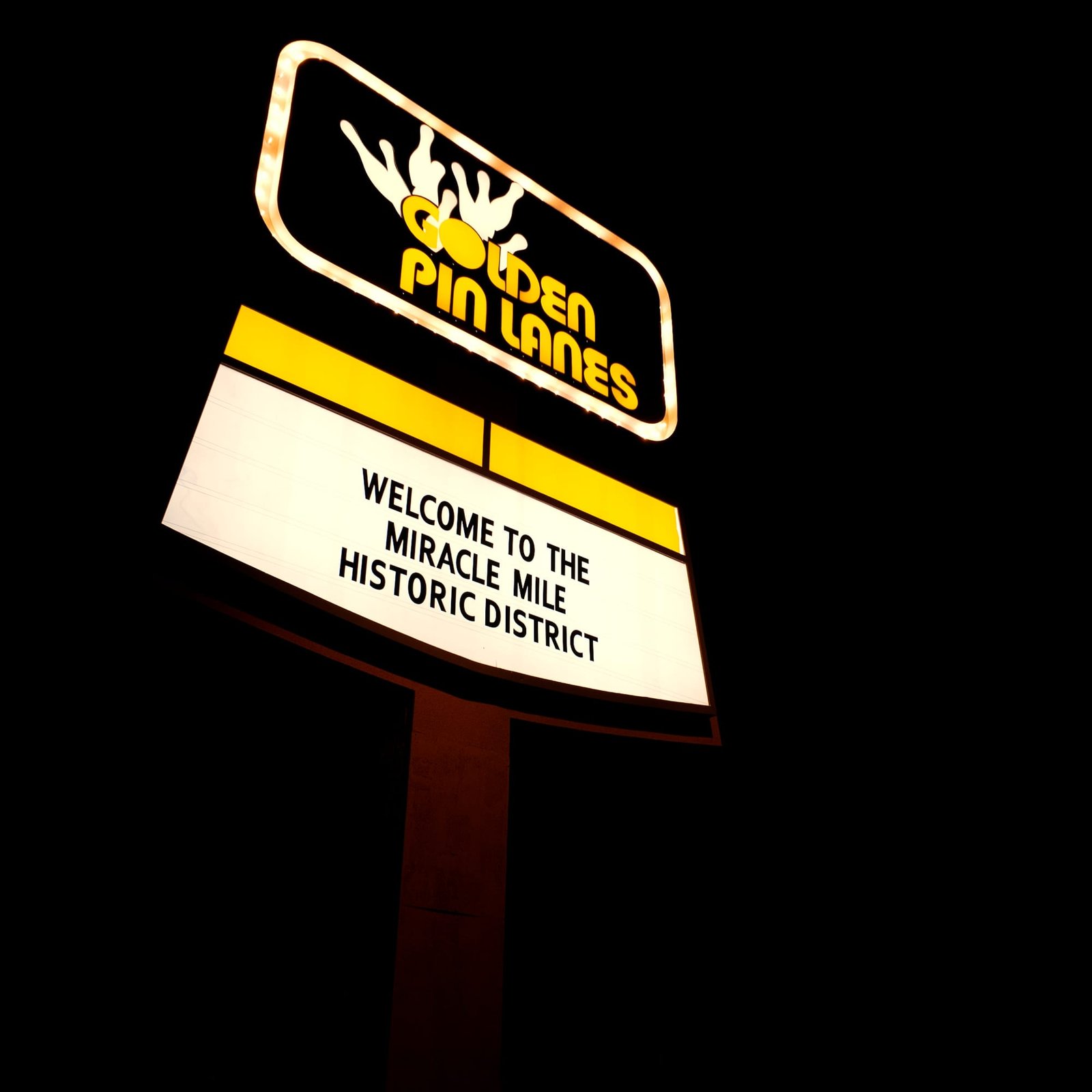 Bowling alley sign glowing at night in Arizona